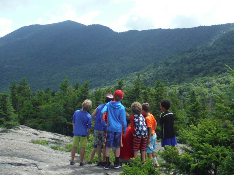 At this Stowe and Waterbury Vermont based summer day camp for kids, we are all about outdoor adventure and recreation. Here are some campers atop Spruce Peak overlooking Mount Mansfield.