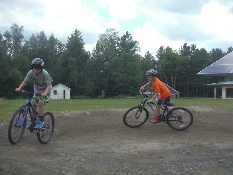 The BMX pump track is very useful for teaching basic mountain bike skills like centering one's weight, weight displacement, railing berms, and linking turns.