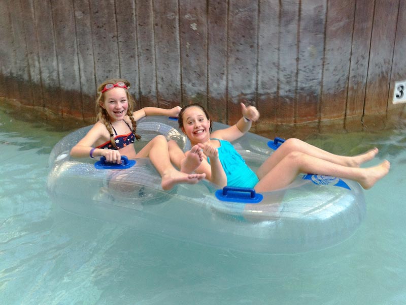 Being lazy in the lazy river at the Jay Peak Water Park with the Mud City Adventures crew from Stowe