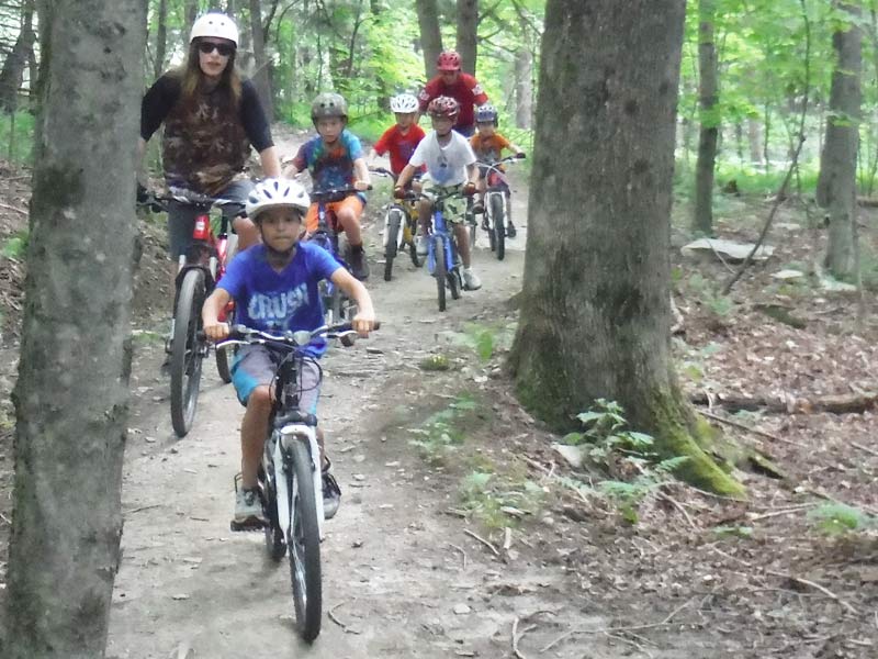 The Mud City gang charges through the woods! Here's a picture of the kids riding through the woods at Trapp Family Lodge.