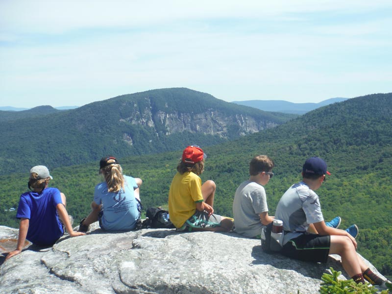 Our campers have fun no matter what. Here are some of our campers after a medium hike in the kingdom of Vermont, soaking in the views.