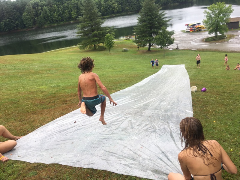 This little camper is having fun splashing around Mud City style. We're the top outdoor day camp for kids in the Waterbury and Stowe area, give us a call.