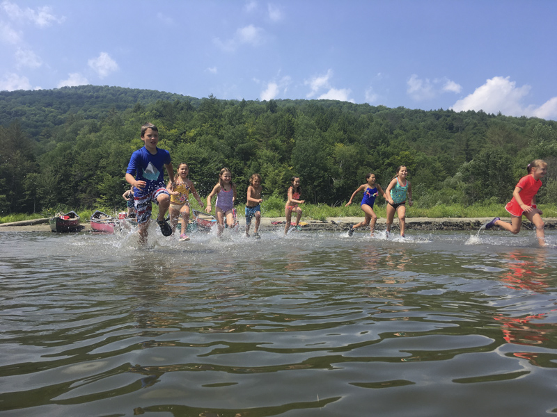 Here are a few campers having fun at the beach with bubbles. Mud City Adventures, based in Stowe, Vermont, operates a day camp program for kids.