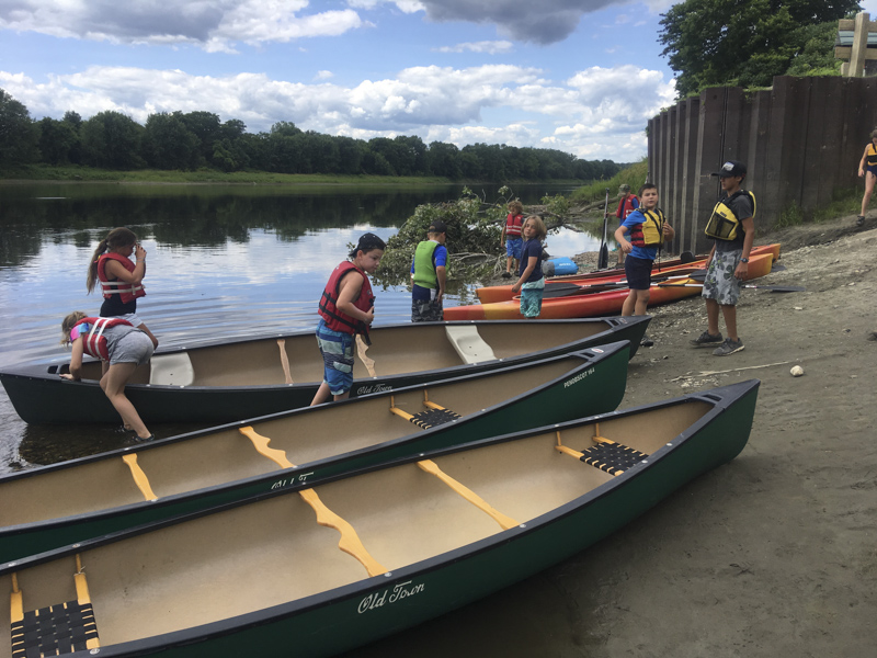 Here's a camper having fun near the water with the Mud City Adventures Day Camp Program for Kids, based in Stowe, Vermont. 